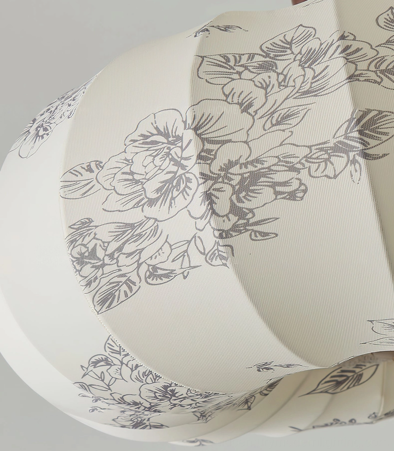 Close-up macro detail of Mantis lamp shade showing grey peony floral print on ribbed fabric texture