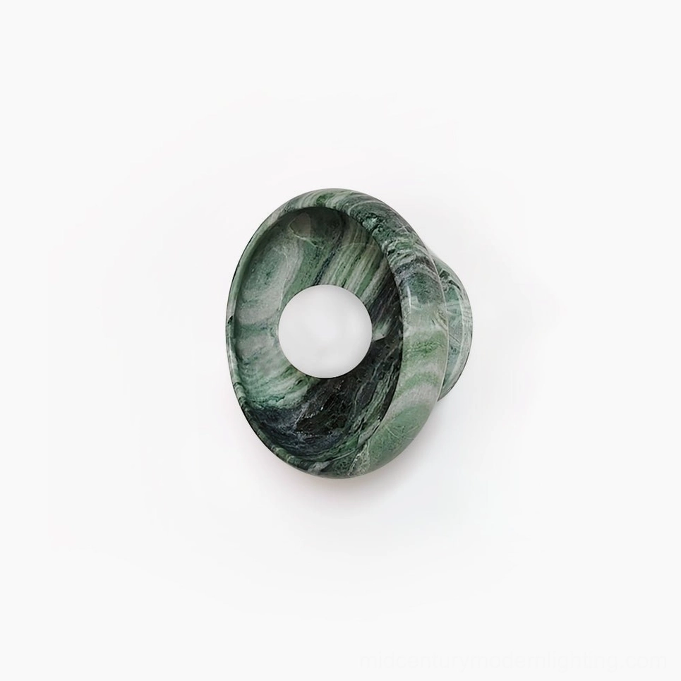 Marble wall lamp with dark green veining on white background, oblique front view showcasing natural stone texture and round fixture