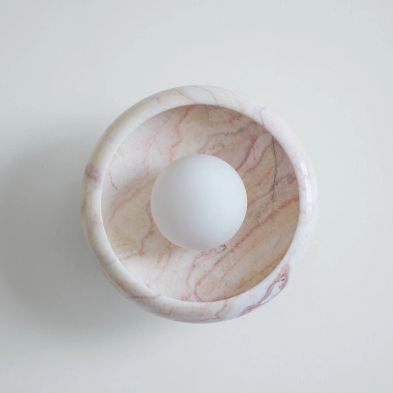 Marble wall lamp design detail showing natural material quality and modern fixture craftsmanship