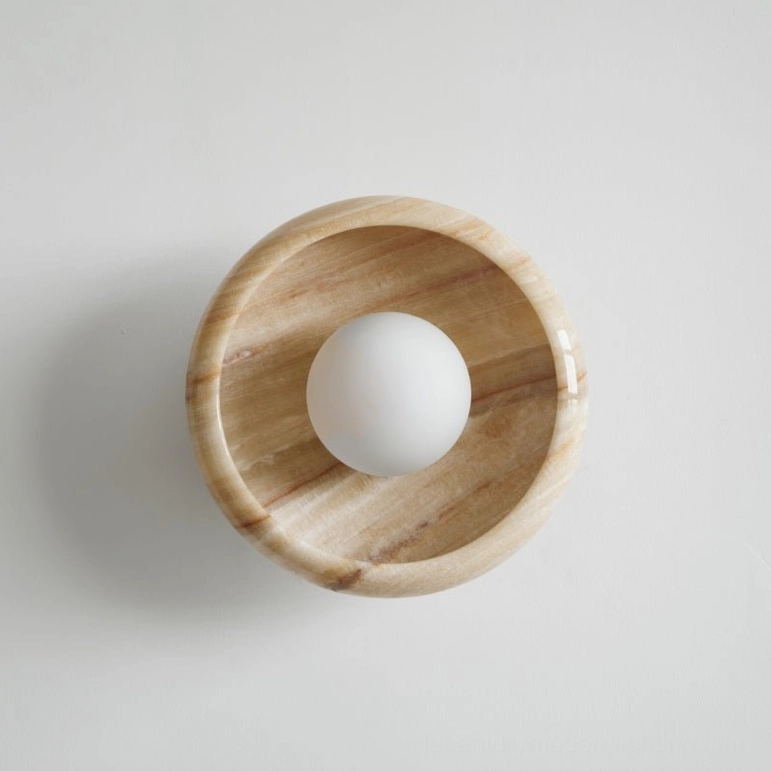Contemporary marble wall lamp light yellow veined stone, smooth matte finish, modern minimalist design aesthetic