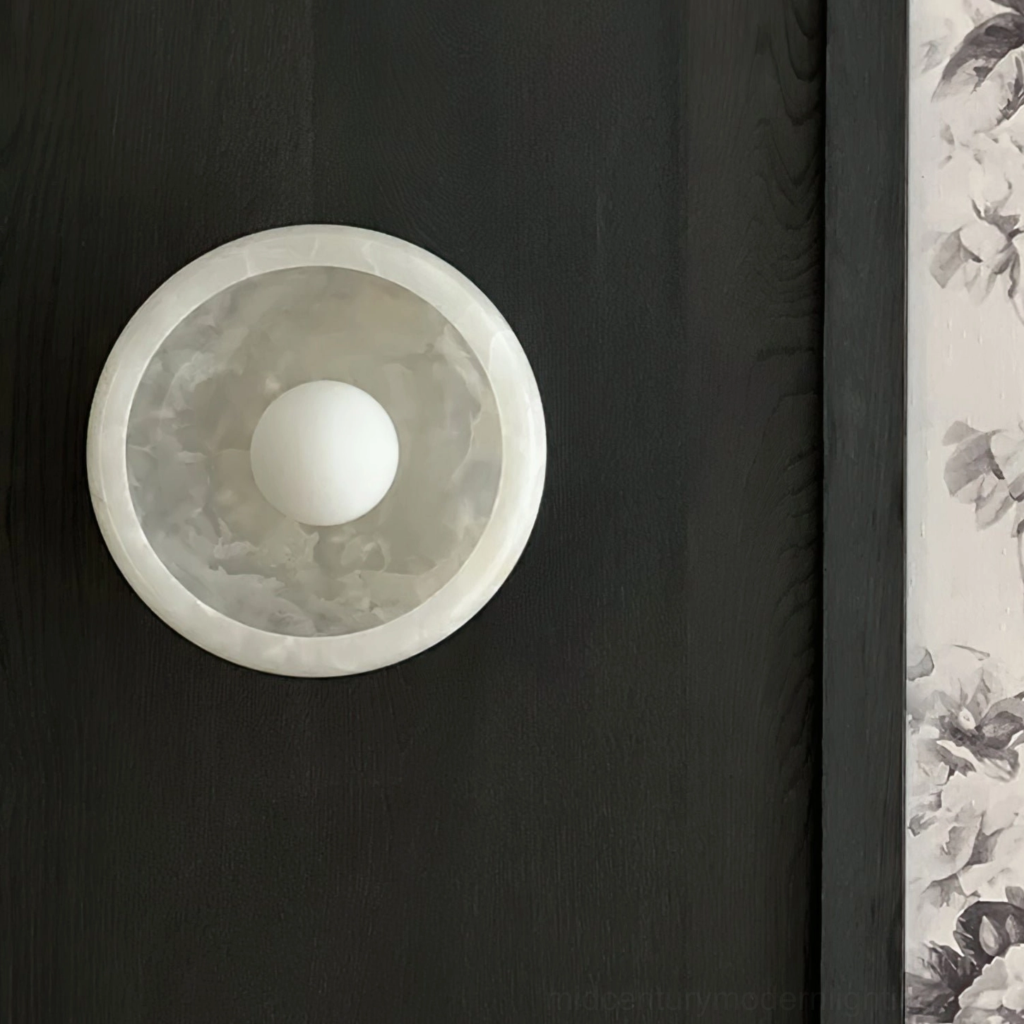 Mid-century modern marble wall lamp featuring natural stone base with contemporary metal fixture