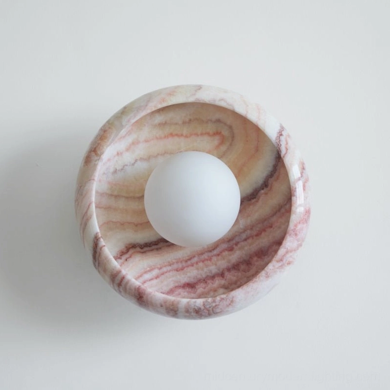 Contemporary marble wall lamp sculptural form combining natural stone with minimalist design