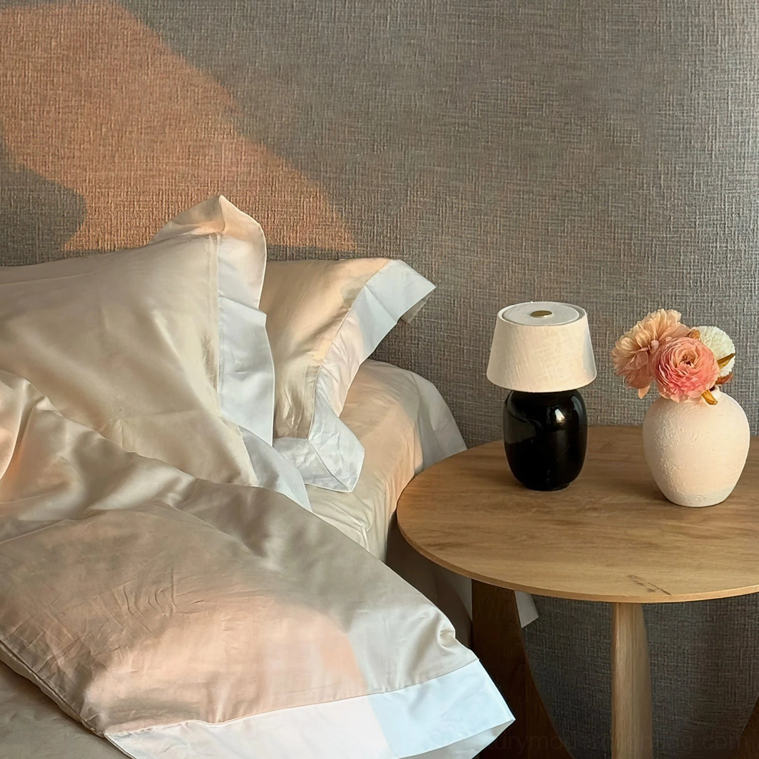 Marie table lamp beige ceramic base on bedroom bedside table with Nordic minimalist decor
