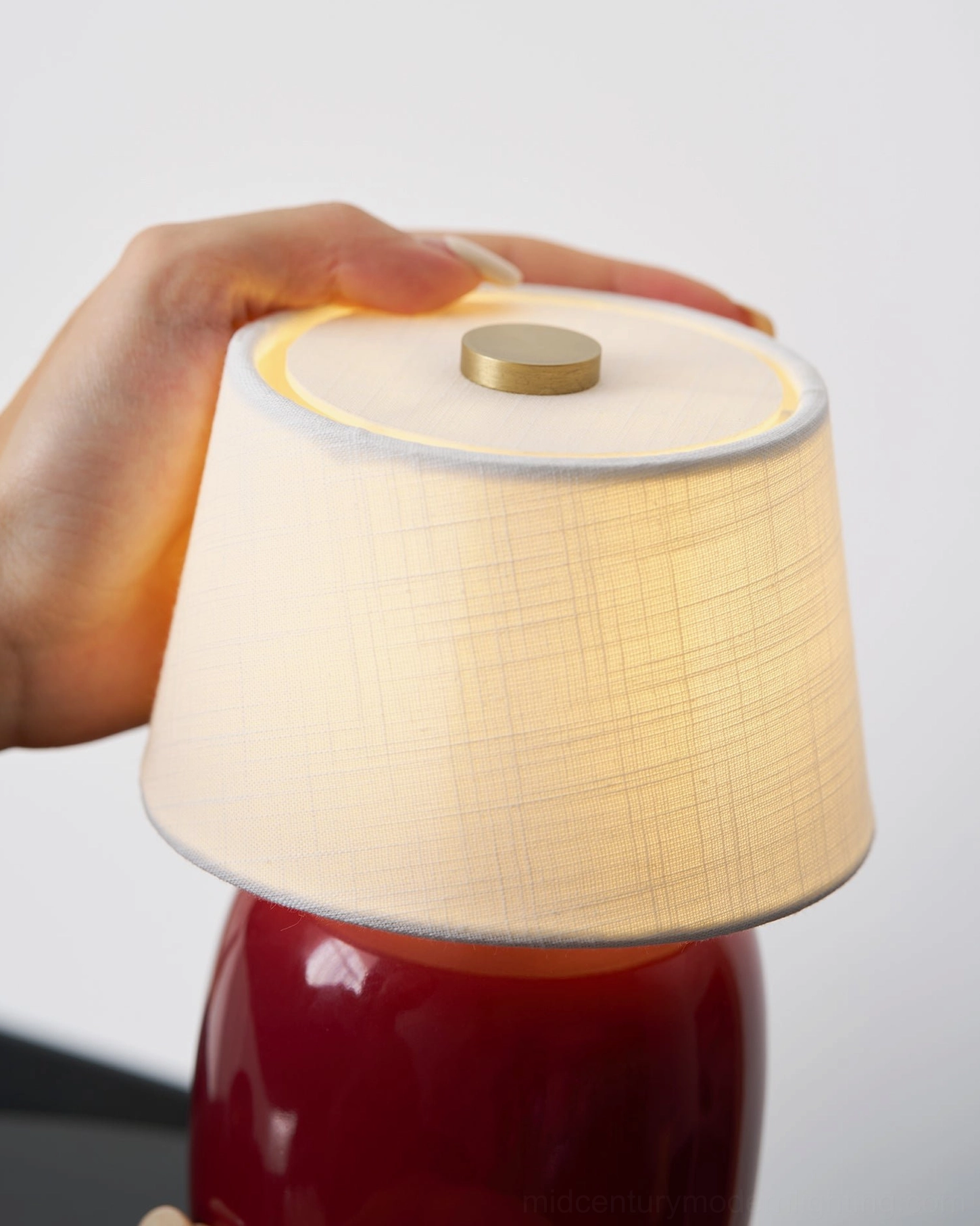 Marie table lamp creating warm ambient glow in evening interior setting