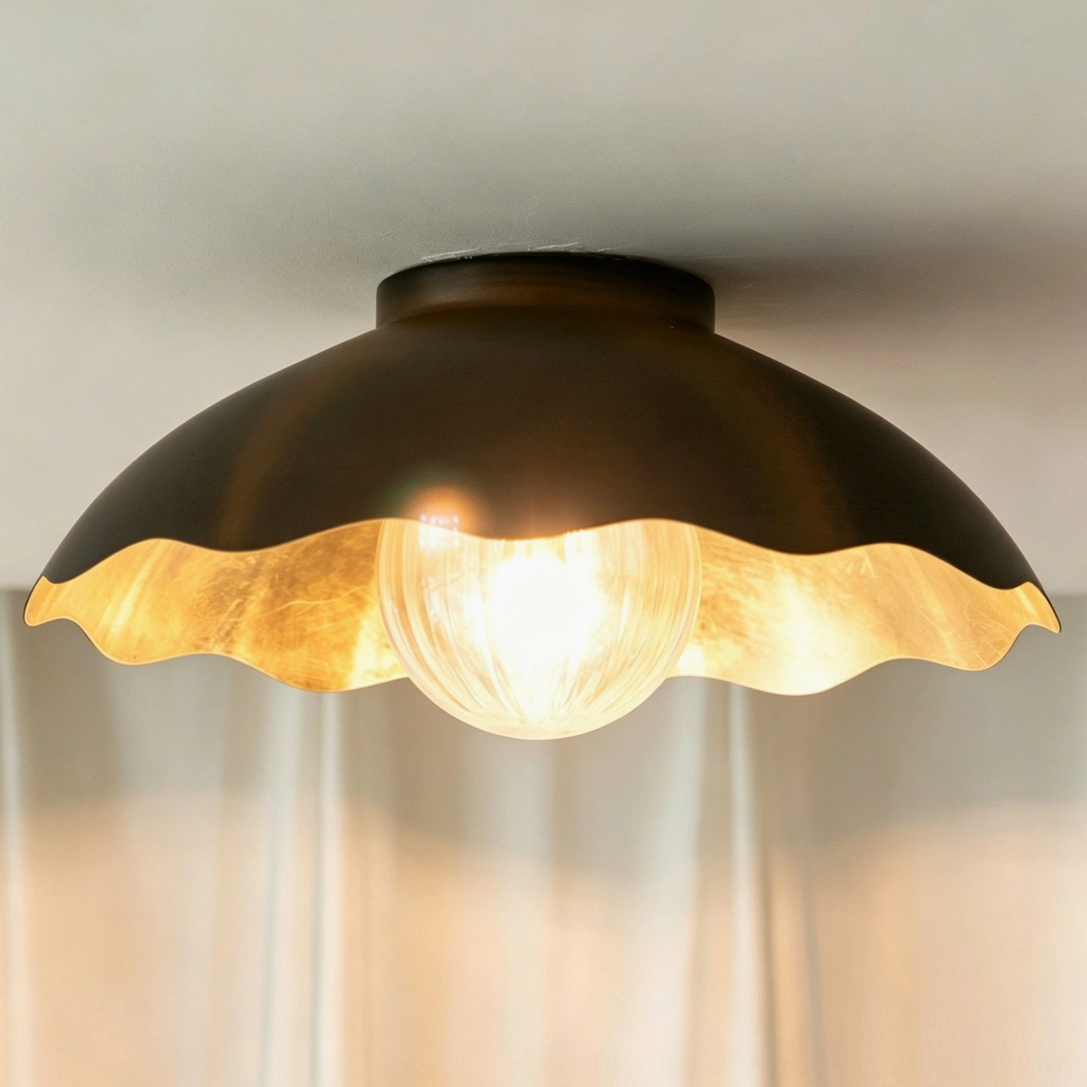 Marlowe scalloped flush mount in contemporary bedroom setting - installed ceiling view with modern decor