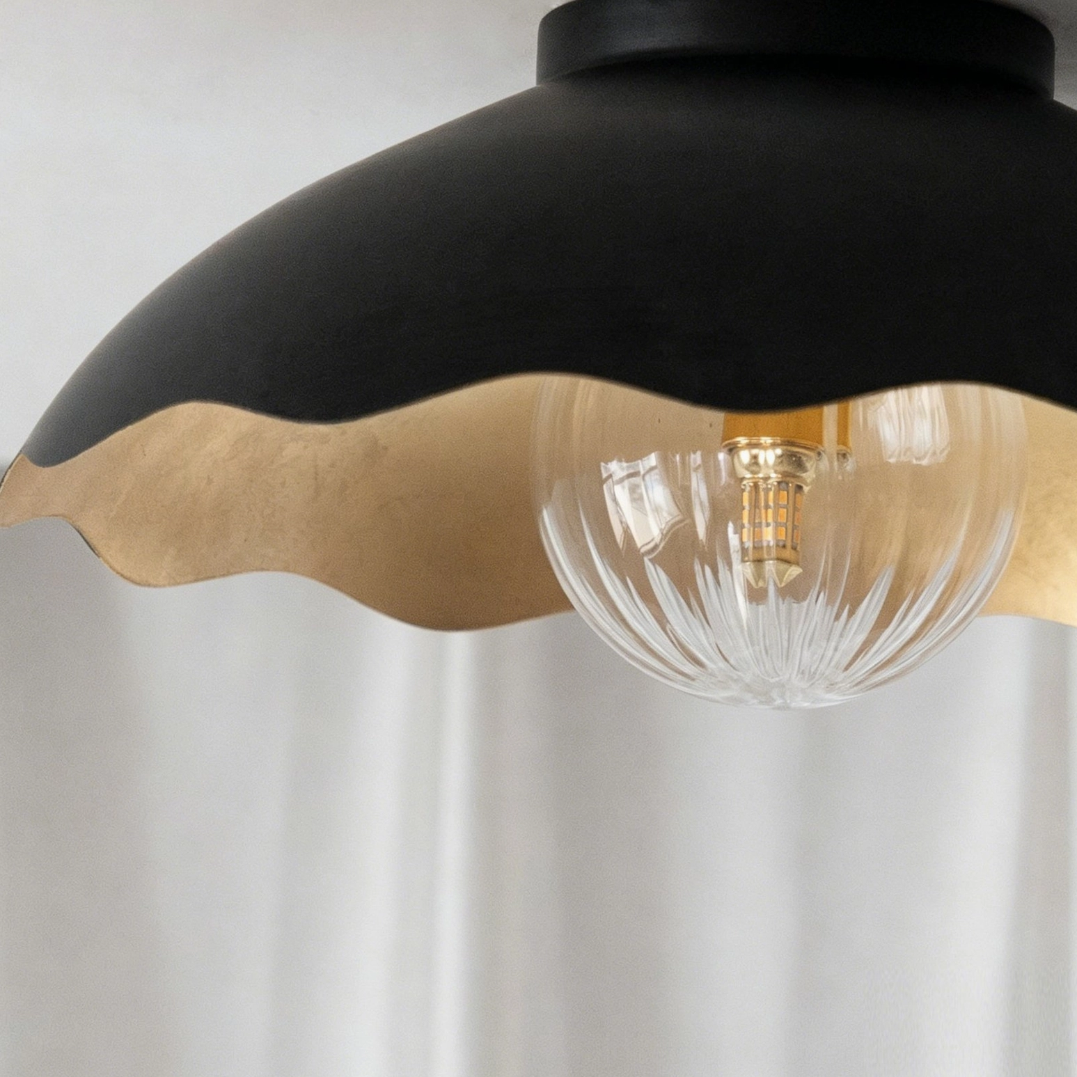 Scalloped ceiling fixture with frosted glass - detail view showing glass diffuser and inner gold trim