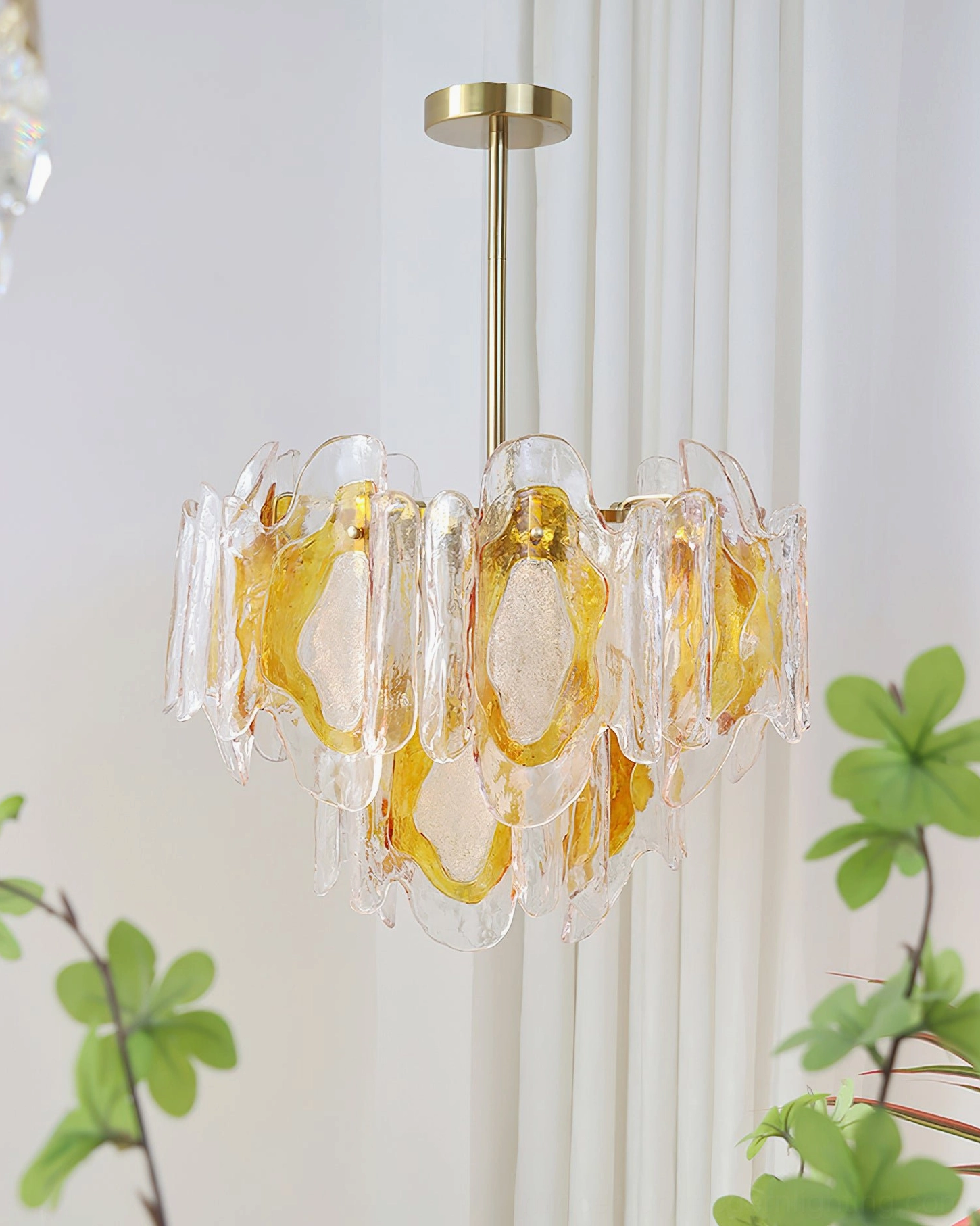 Marrina centered amber glass pendant chandelier overhead view with layered artisanal glass panels illuminated