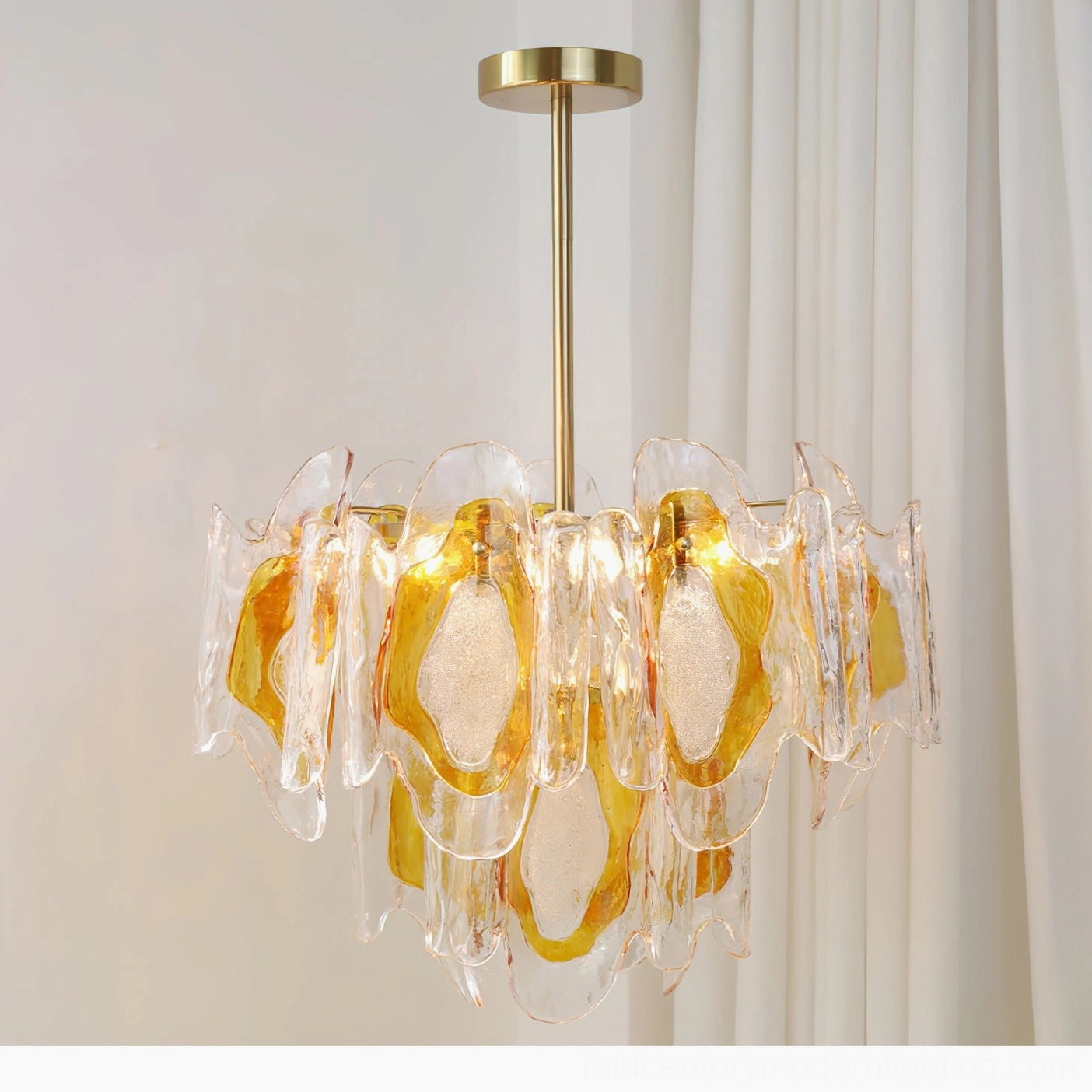 Marrina compact amber glass chandelier close-up front view showing glass gradient and polished brass mount
