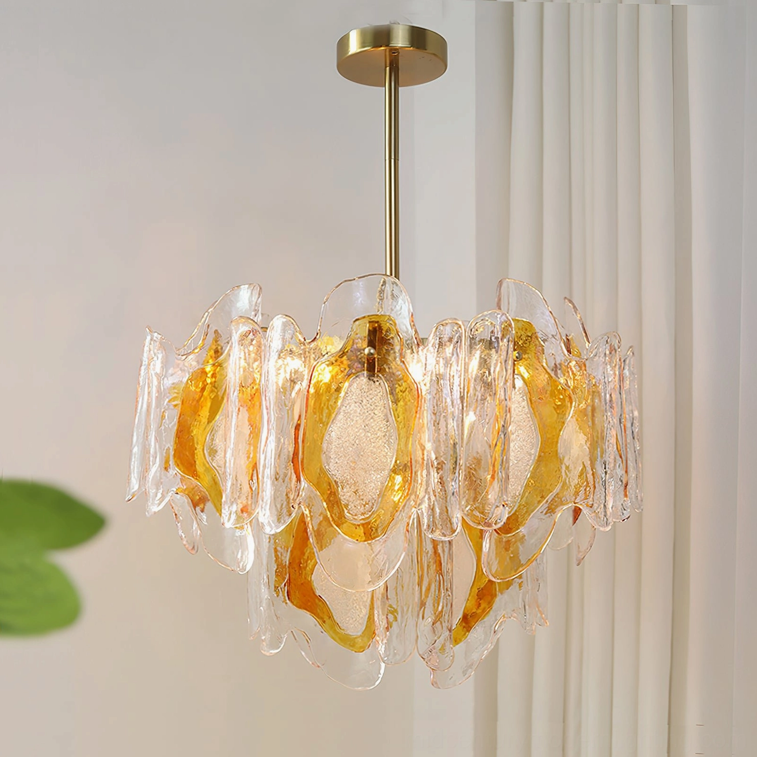 Marrina amber glass chandelier side-front three-quarter view demonstrating symmetrical tiered glass structure