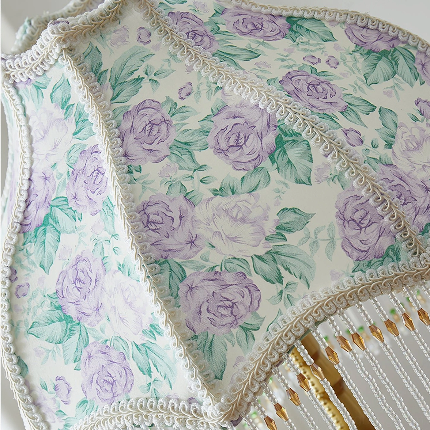 Masa beaded table lamp fabric shade detail with purple rose floral print green leaf patterns and beaded tassel trim