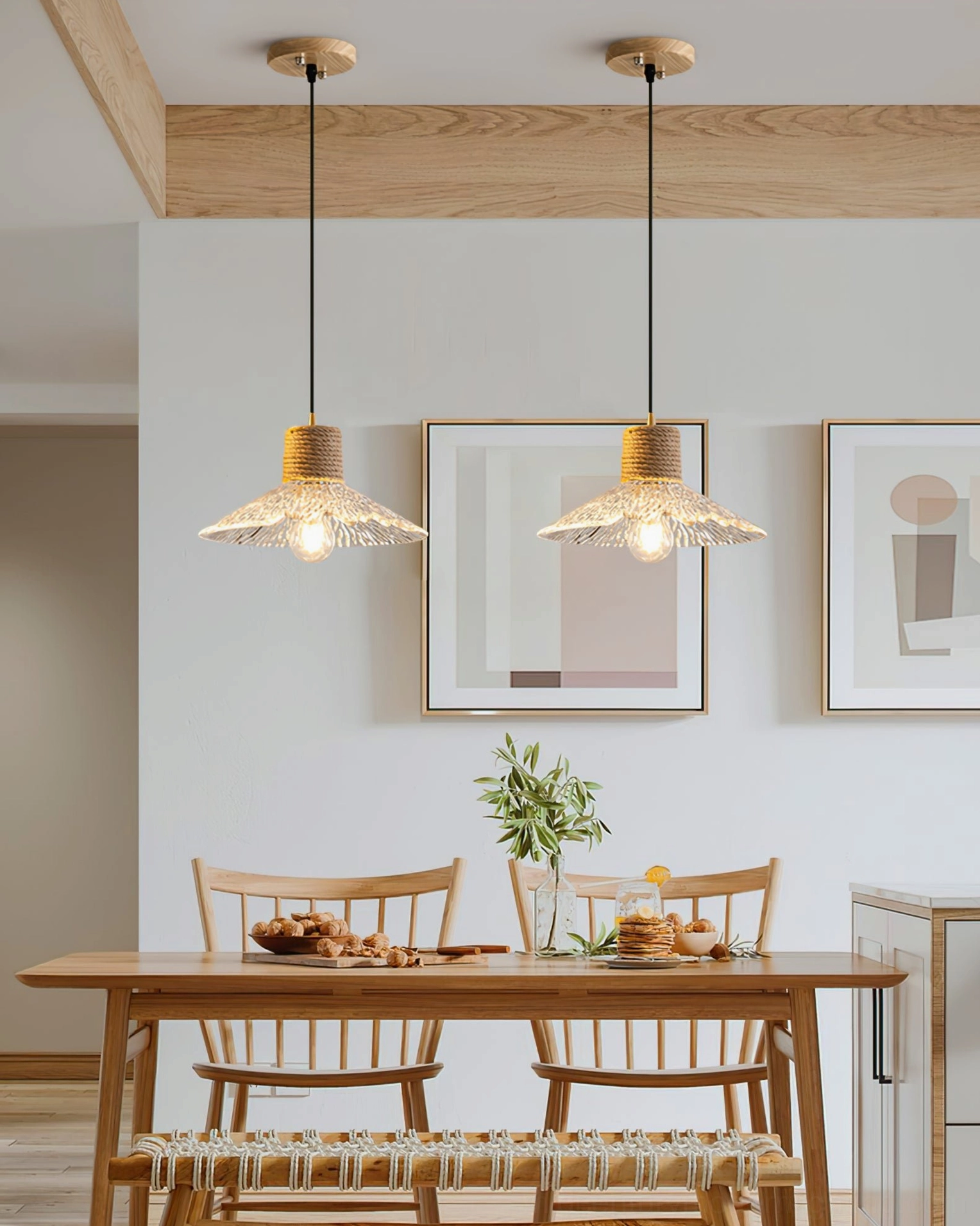 Two matching hemp rope glass pendant lamps hanging in modern farmhouse dining room, high-angle overhead perspective