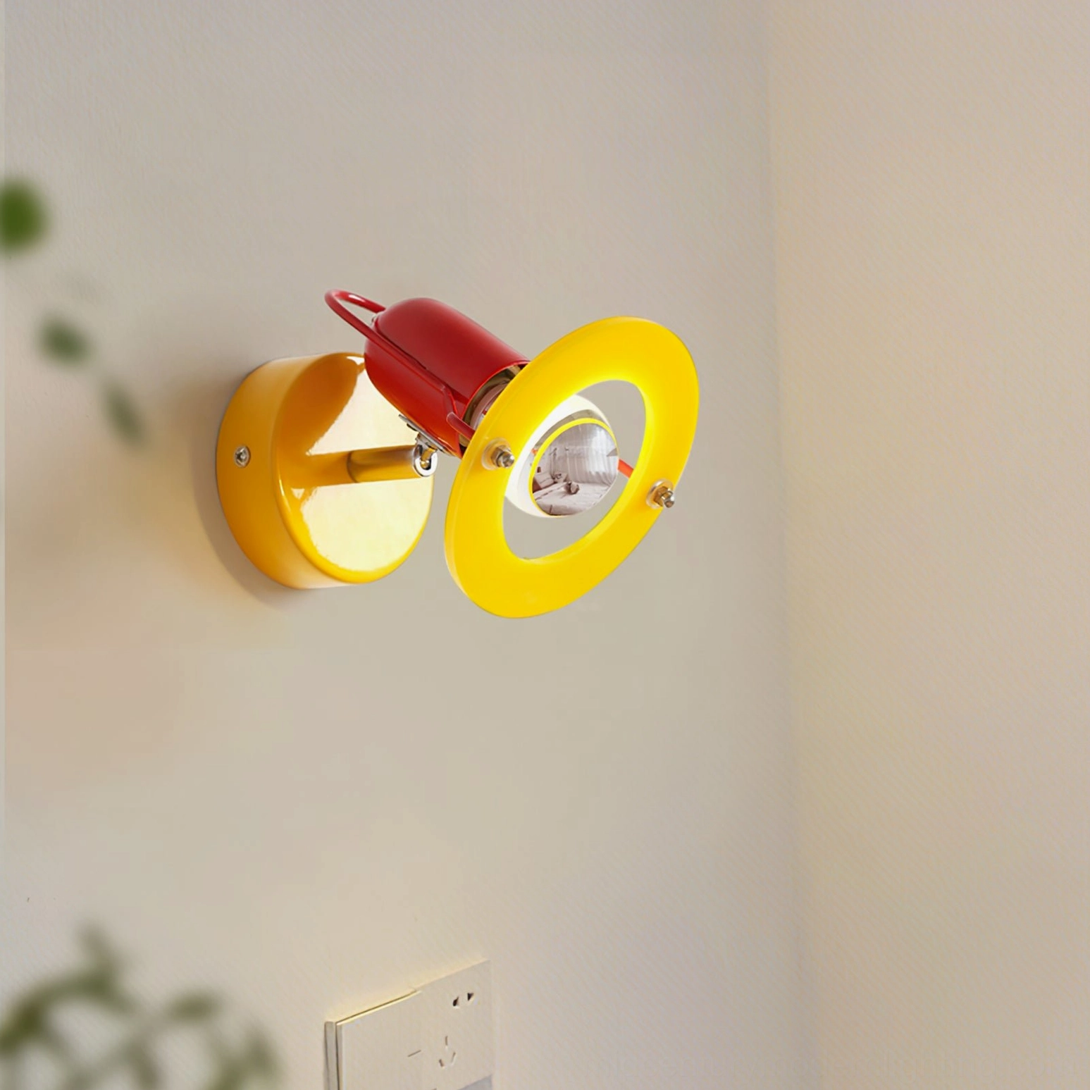 Maurer wall lamp illuminated in interior corner with green plants, warm ambient lighting demonstration