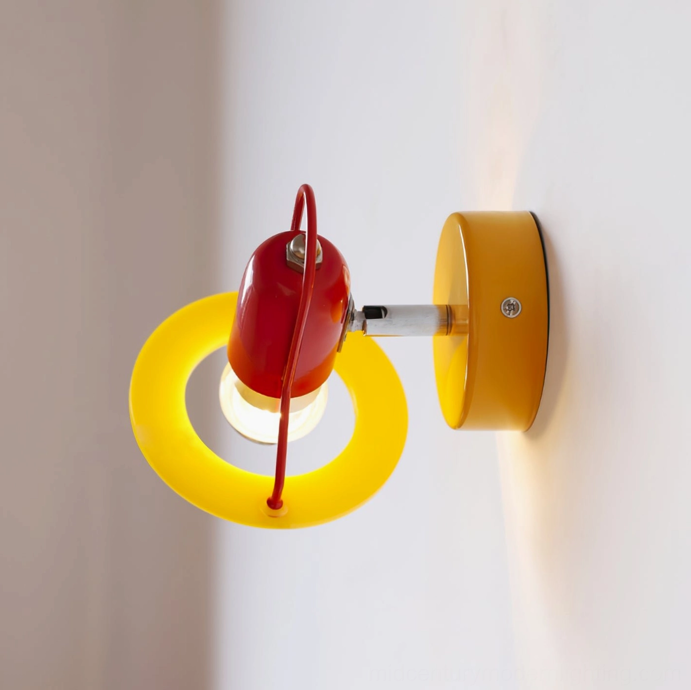 Maurer wall lamp mounted on white wall, side profile showing reversed shade and mounting screws