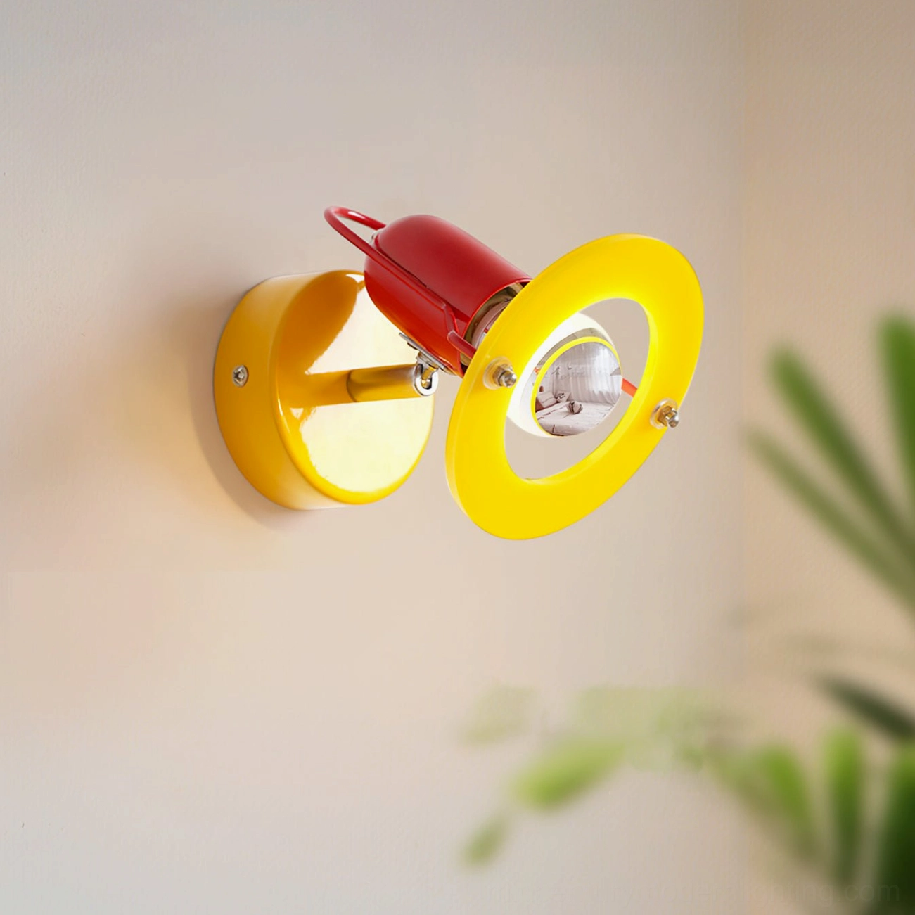 Maurer wall lamp on wall with bright yellow shade ring glowing, soft wall ambient light effect