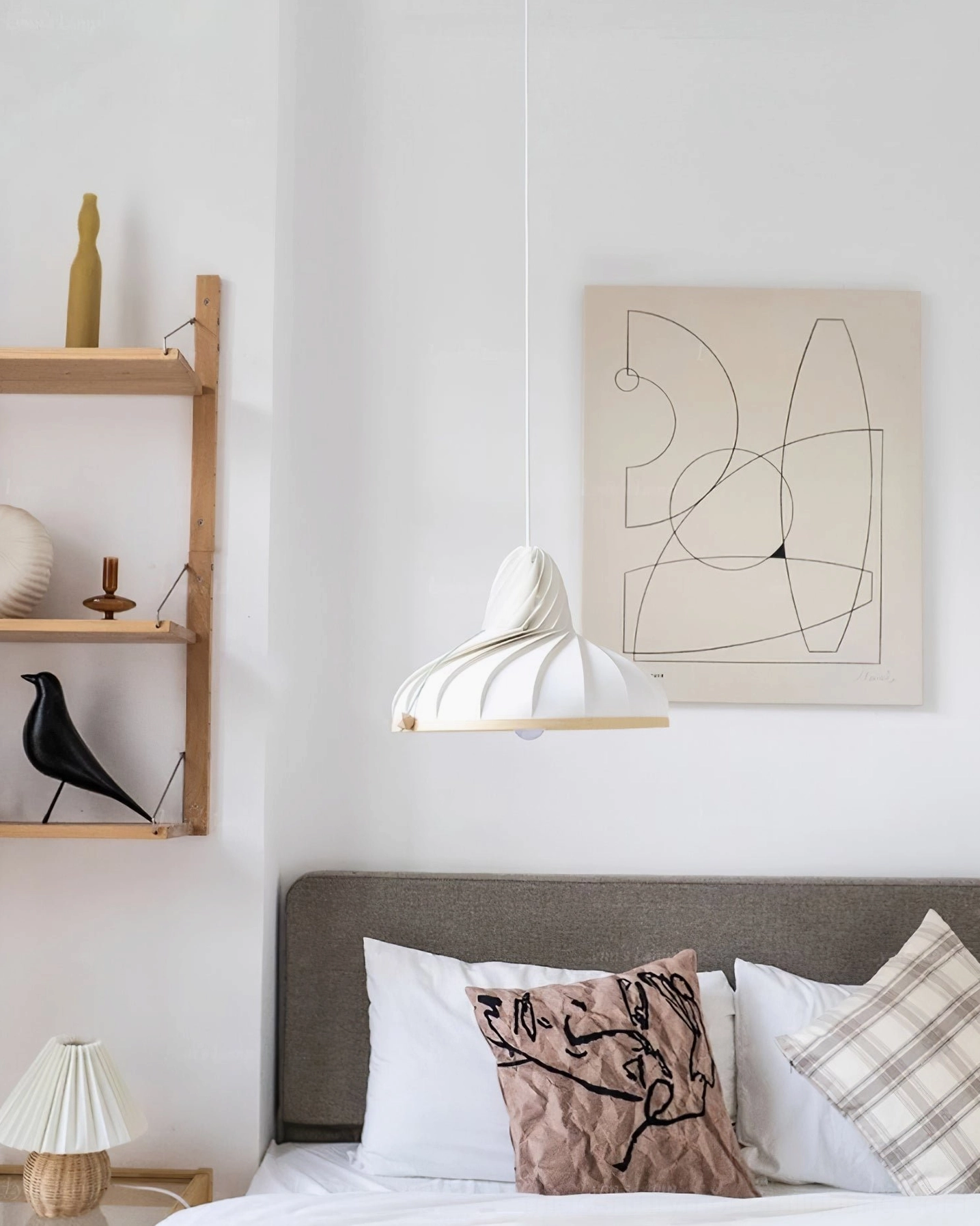 Single Meblo pendant lamp hanging in cozy neutral bedroom corner decor