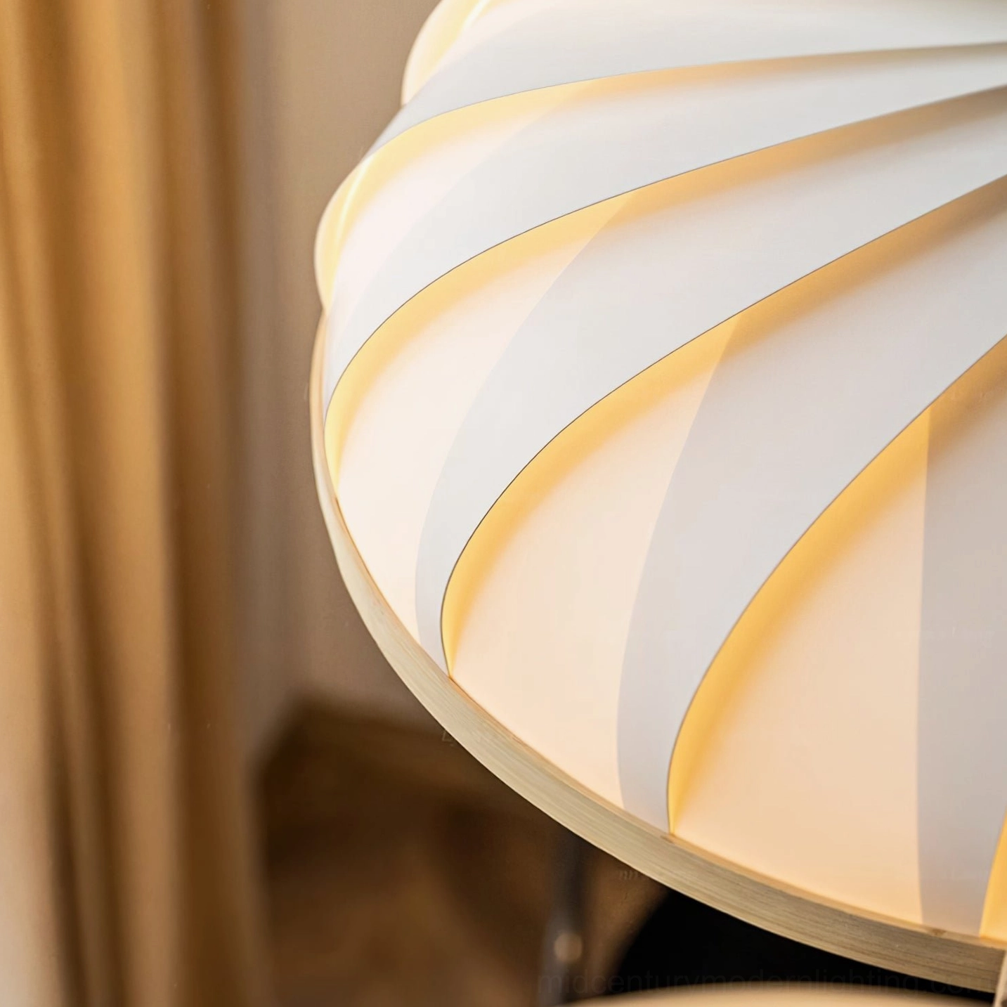 Illuminated Meblo pendant lamp casting warm soft ambient light through ribbed shade