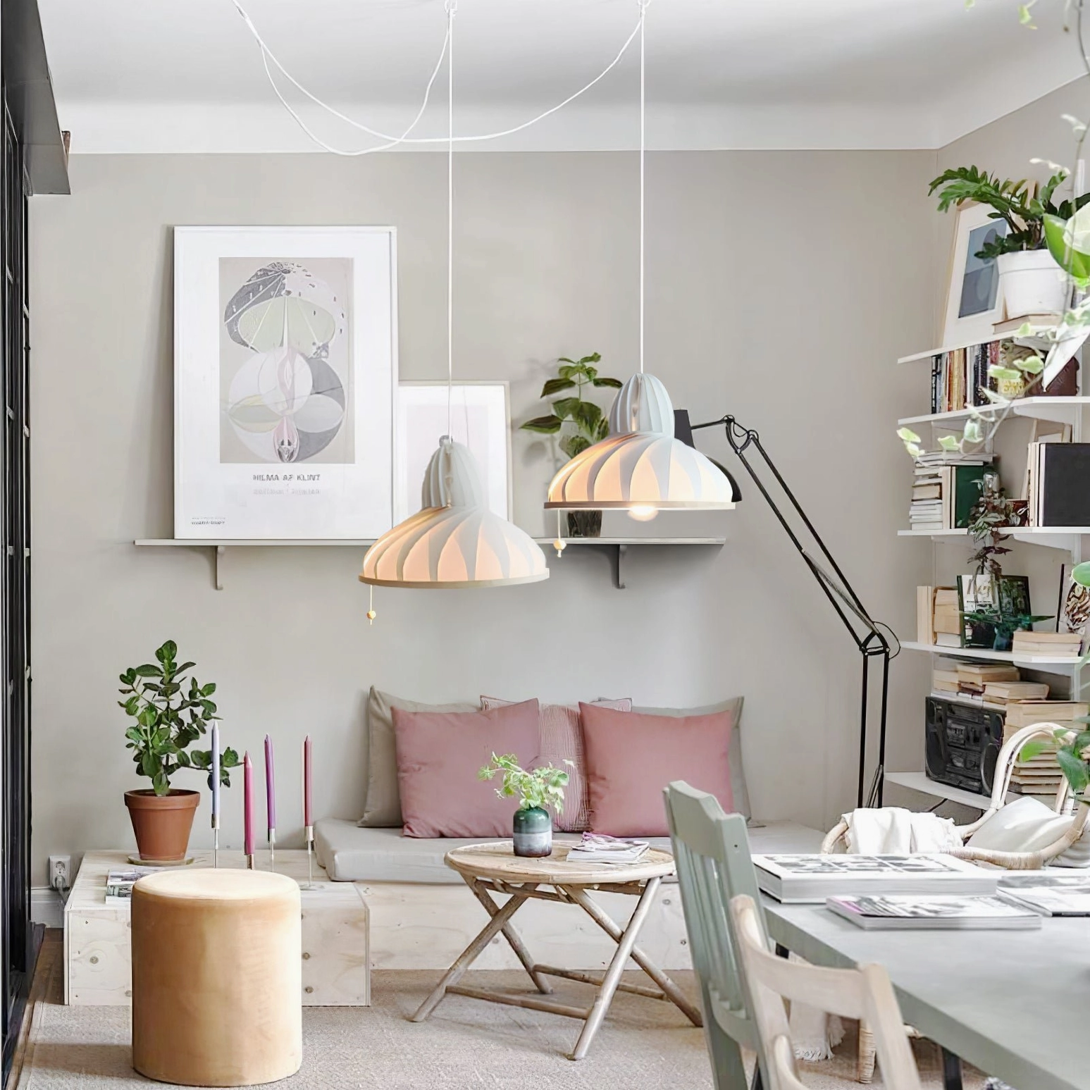 Two matching Meblo pendant lamps above dining and workspace in modern home interior