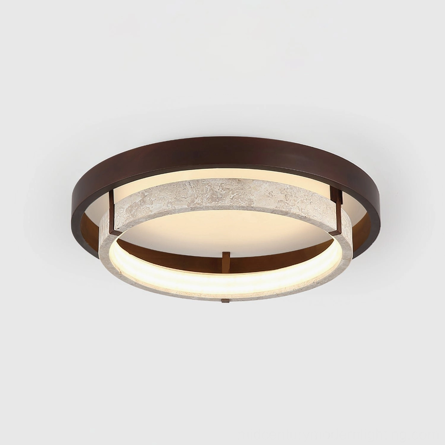 Three-quarter angle view of modern travertine ceiling light with dual-layer ring structure and warm LED glow