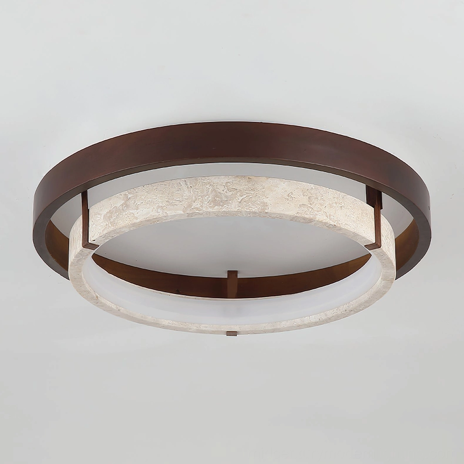 Menine ceiling light architectural detail showing proportions and natural stone surface variations