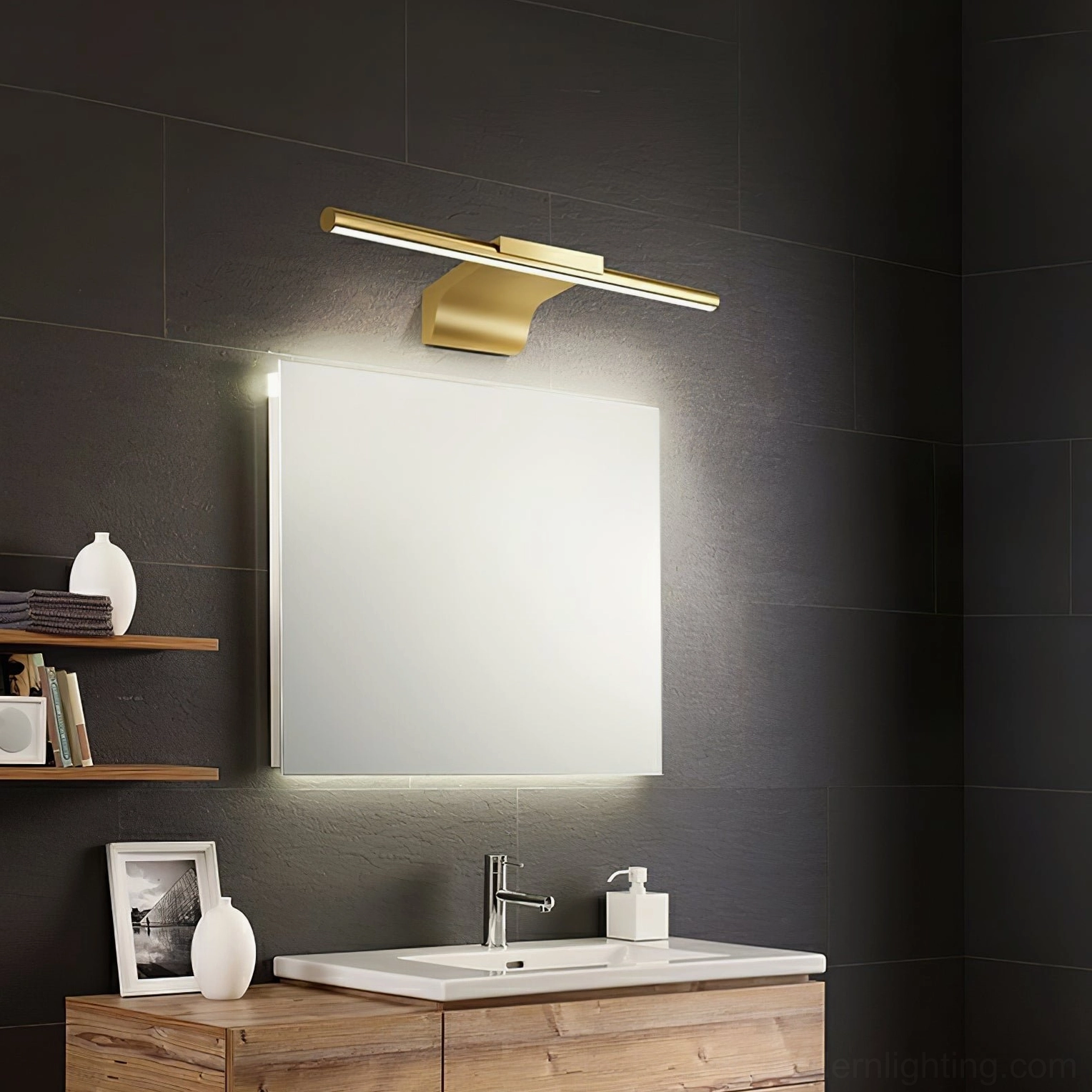 Metallic streamlined wall lamp side profile showing acrylic and brass construction