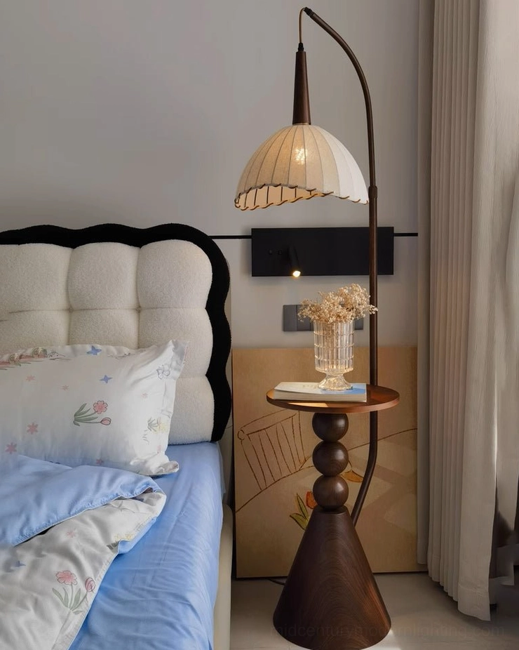 Mid-century modern arc floor lamp with integrated wooden side table, sculptural metal frame design