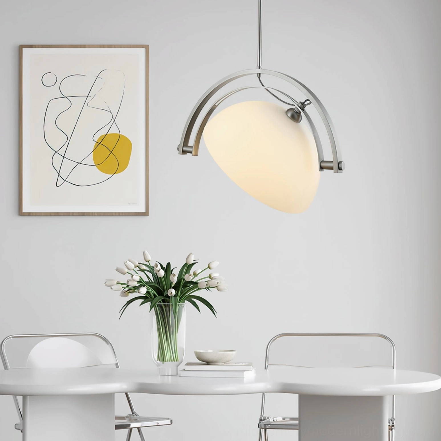 Mid-century arc pendant light fixture detail showcasing chrome metal construction and adjustable design mechanism