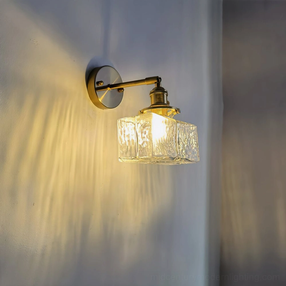 Mid-century modern brass glass wall sconce with rippled shade architectural detail shot