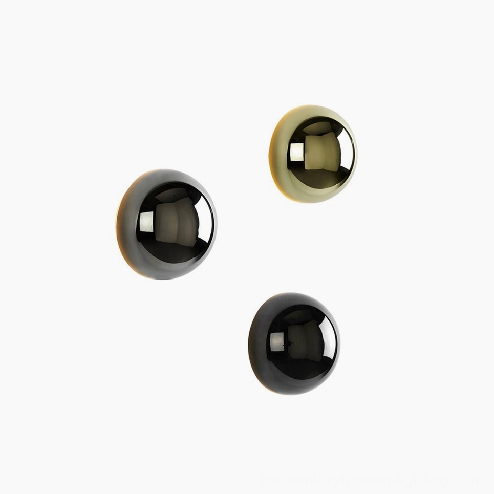 Design-forward sphere wall sconce exemplifying mid-century modern geometric aesthetics