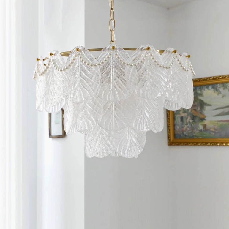 Three-quarter front view of mid-century glass leaf pendant chandelier in white room setting, showcasing pearl frosted glass layers and brass frame construction
