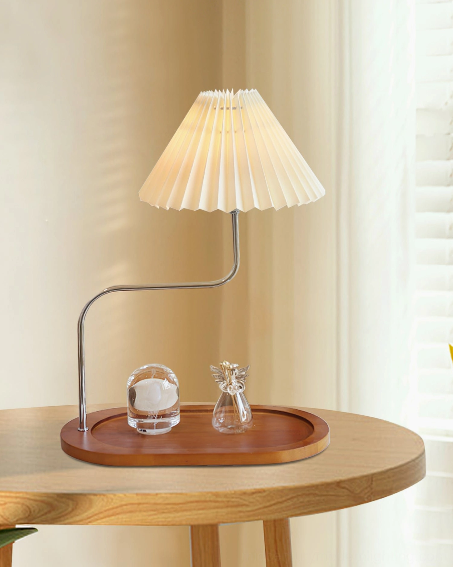 Mid-century modern table lamp detail showing pleated fabric shade and wood base construction