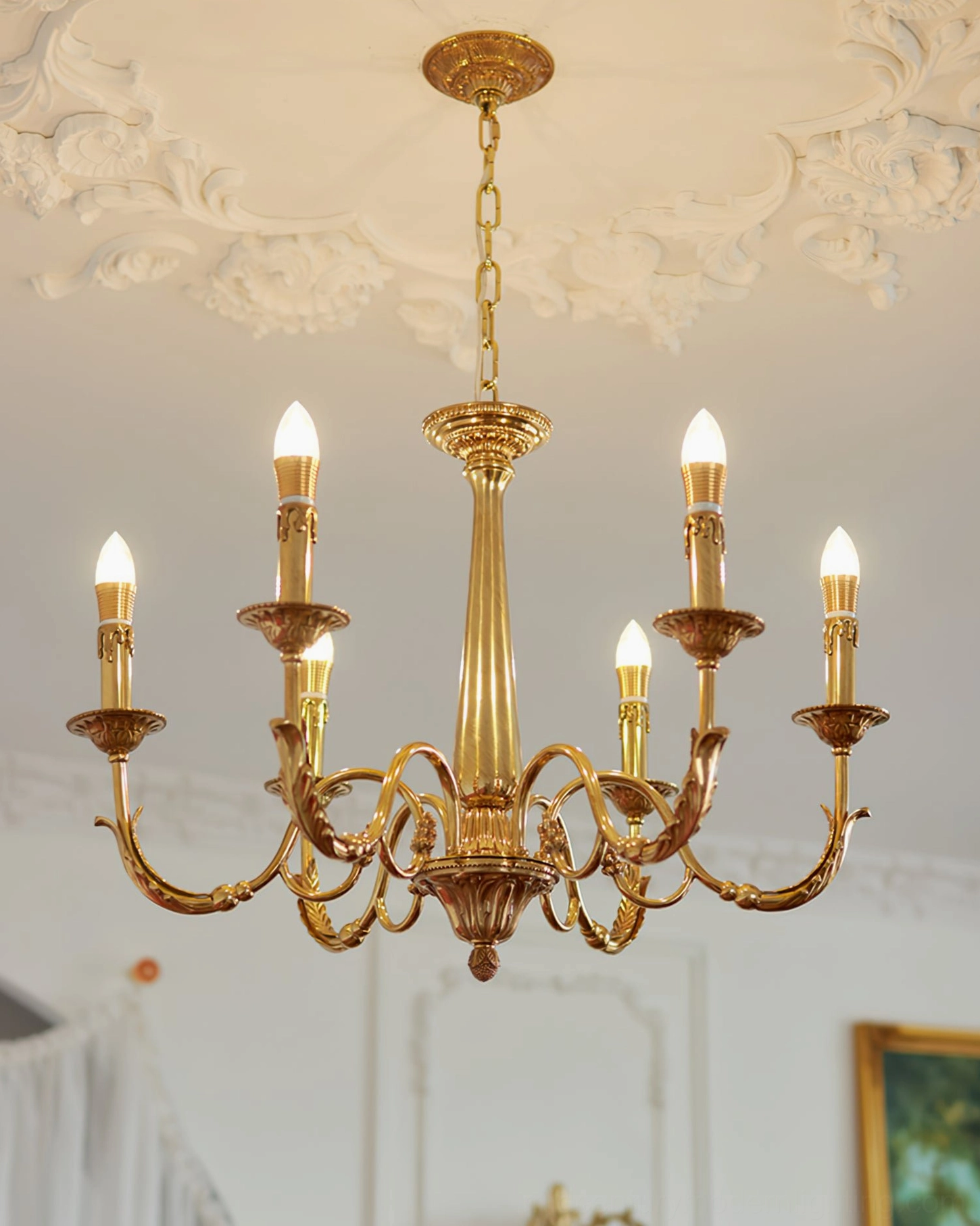 Mid-century modern brass candle chandelier with classic candle bulb design and polished finish