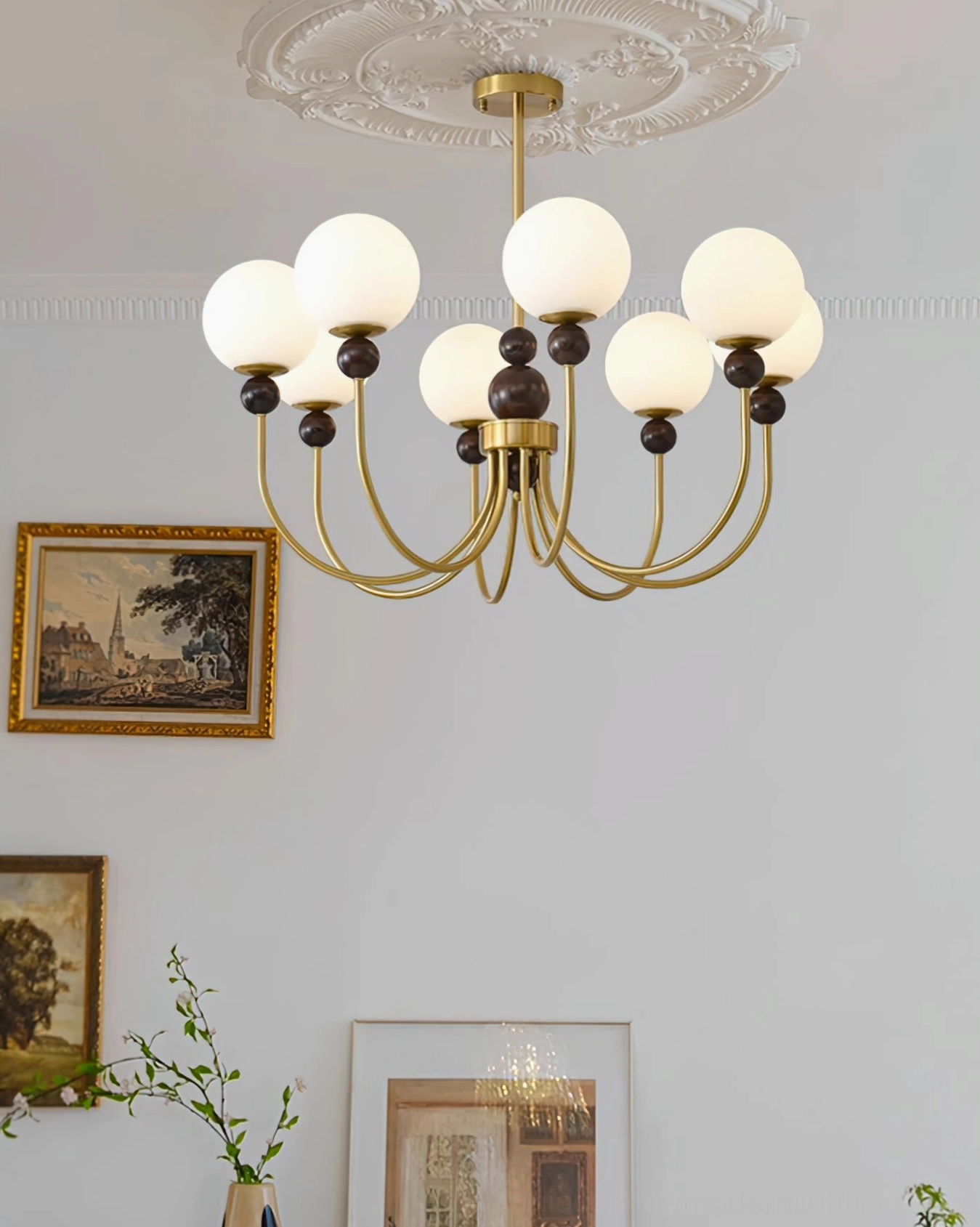 Mid-century modern glass pendant chandelier in minimalist vintage living room with green plants