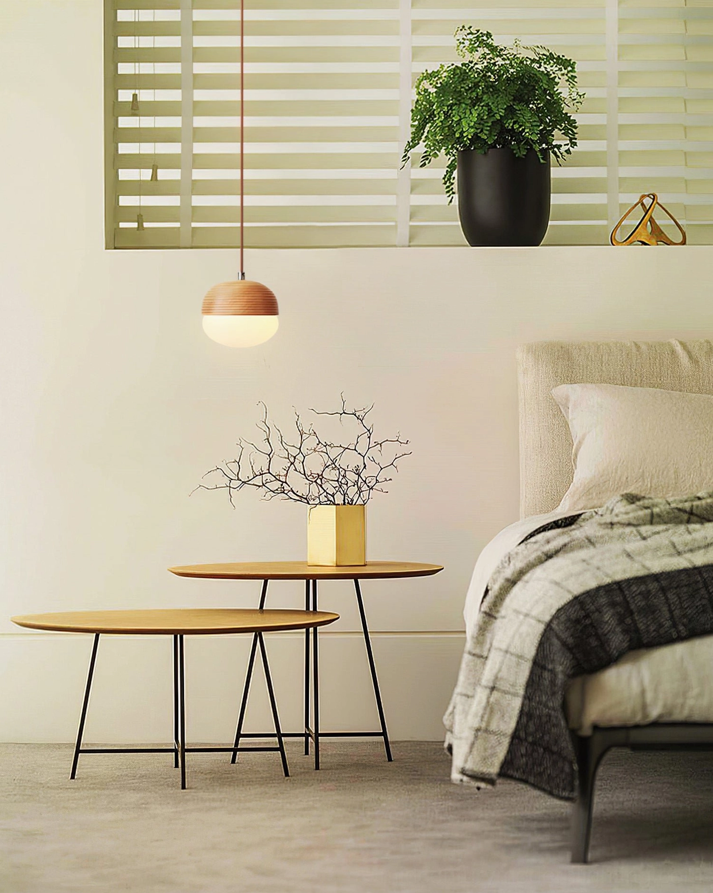 Mid-century modern pendant light creating warm ambiance over bedroom side table, contemporary interior design