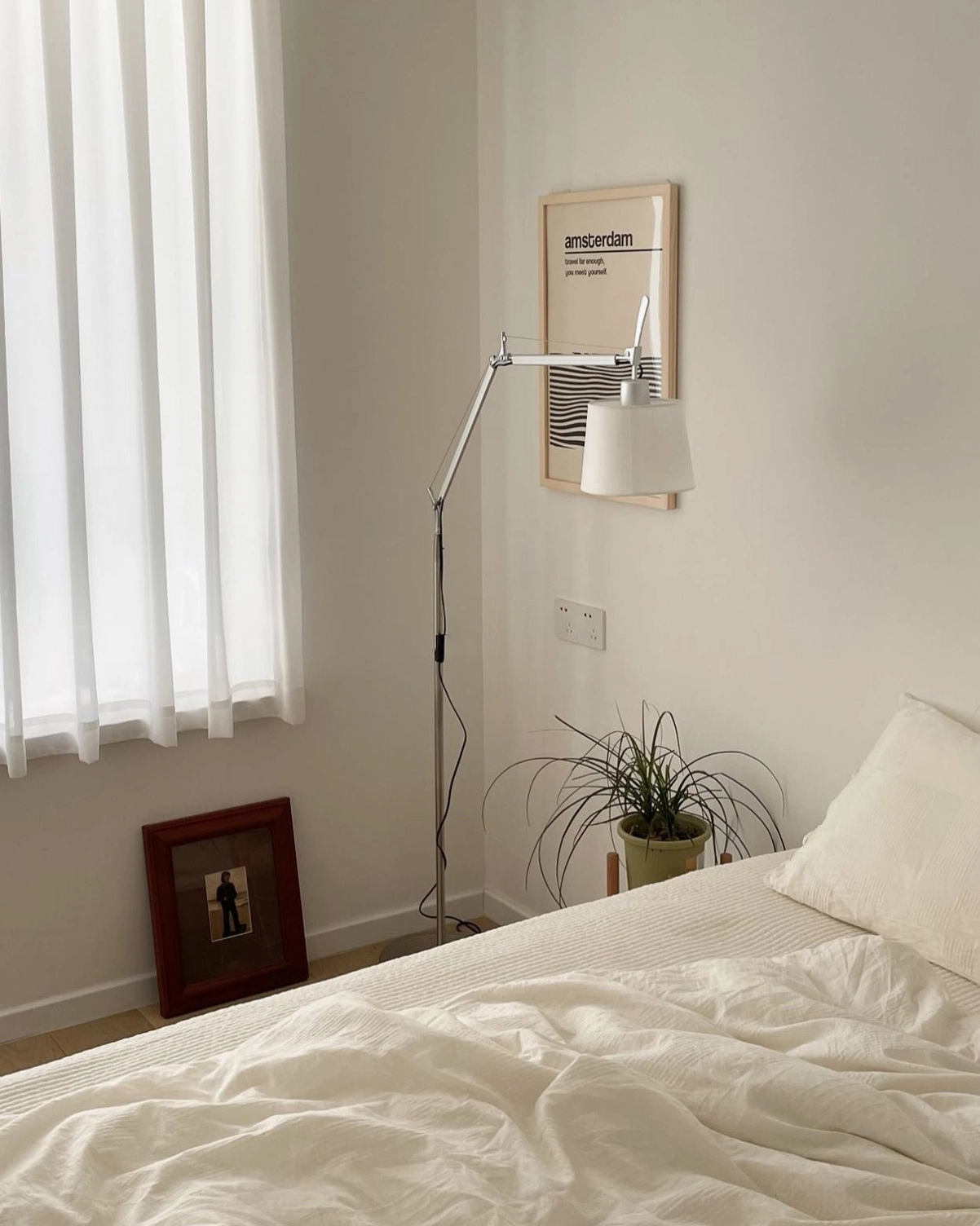 Mid-century swing arm floor lamp showcasing flexible positioning capability and sculptural metal frame design