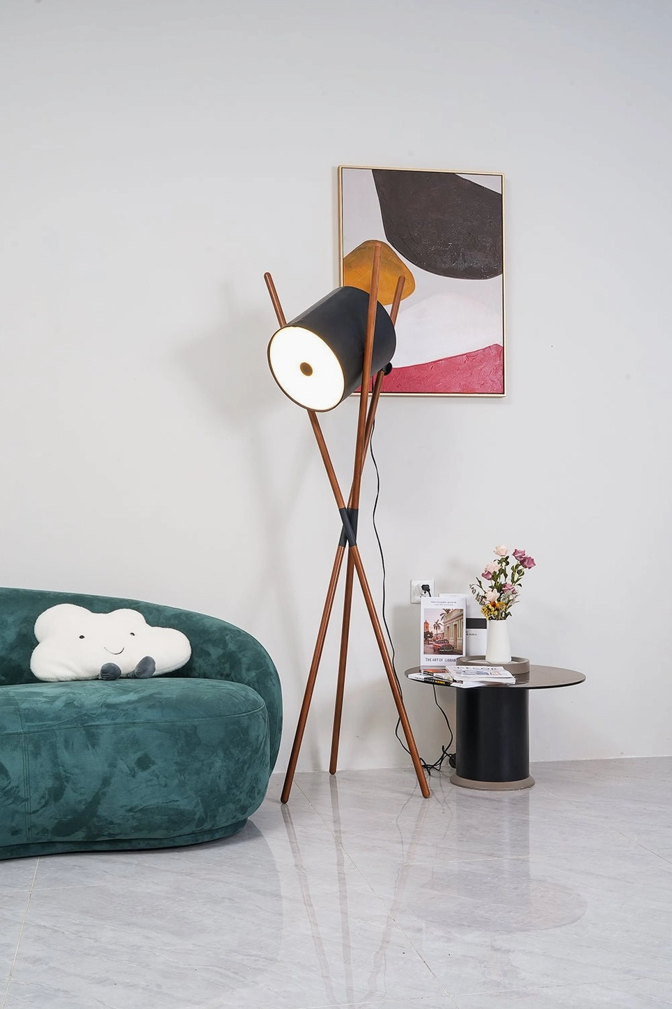Mid-century modern tripod floor lamp with angled shade in minimalist Scandinavian living space