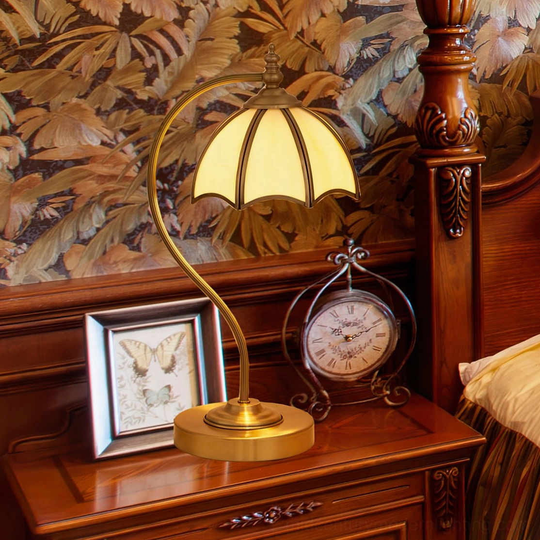 Mid-century umbrella table lamp showing elegant curved brass construction and light diffusion