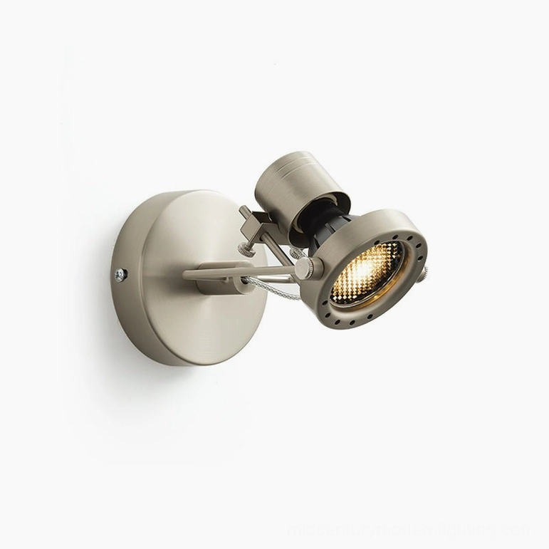 Front-right angled view of illuminated wall spotlight with braided support cable and mid-century modern styling