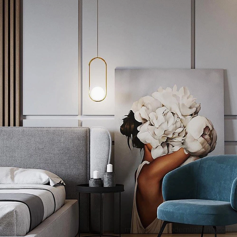 Mila geometric pendant light installation showing detailed view of metal frame connection and glass shade mounting