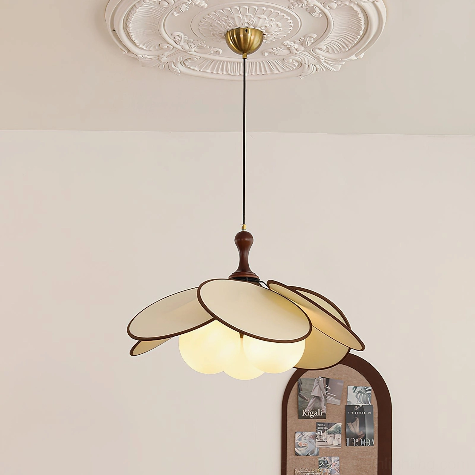 Miley pendant light bottom view under decorative ceiling medallion installation