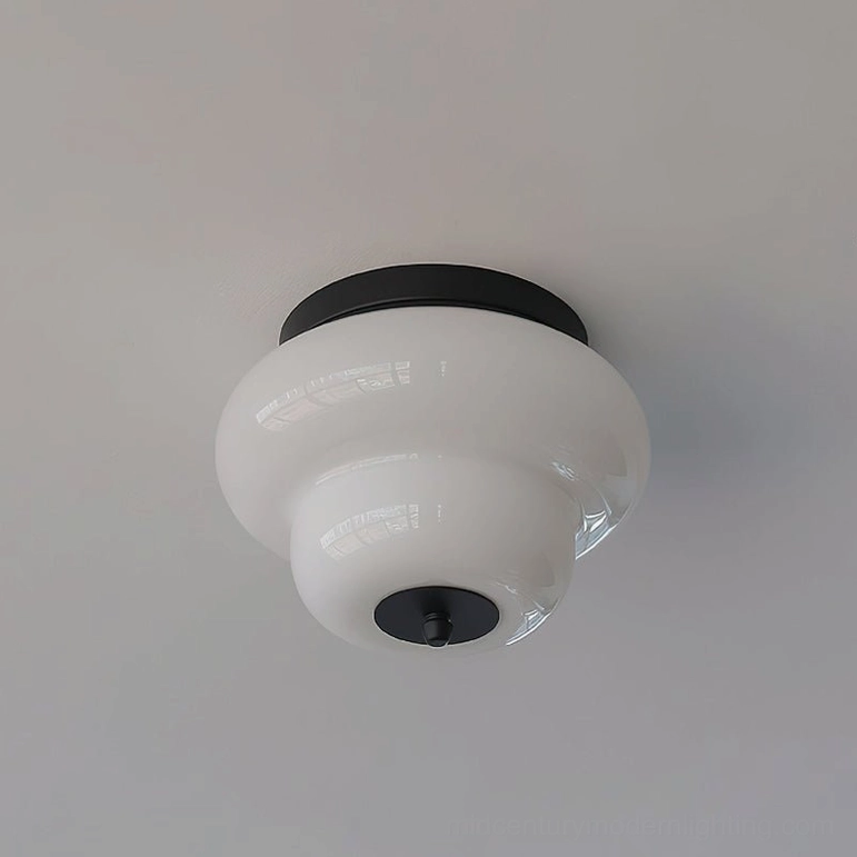 Milo flush mount ceiling fixture in black finish with warm white integrated LED in contemporary modern interior