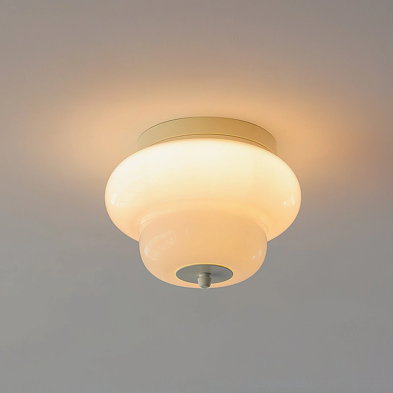 Milo mid-century modern flush mount ceiling light showing metal backplate and hand-blown glass assembly detail
