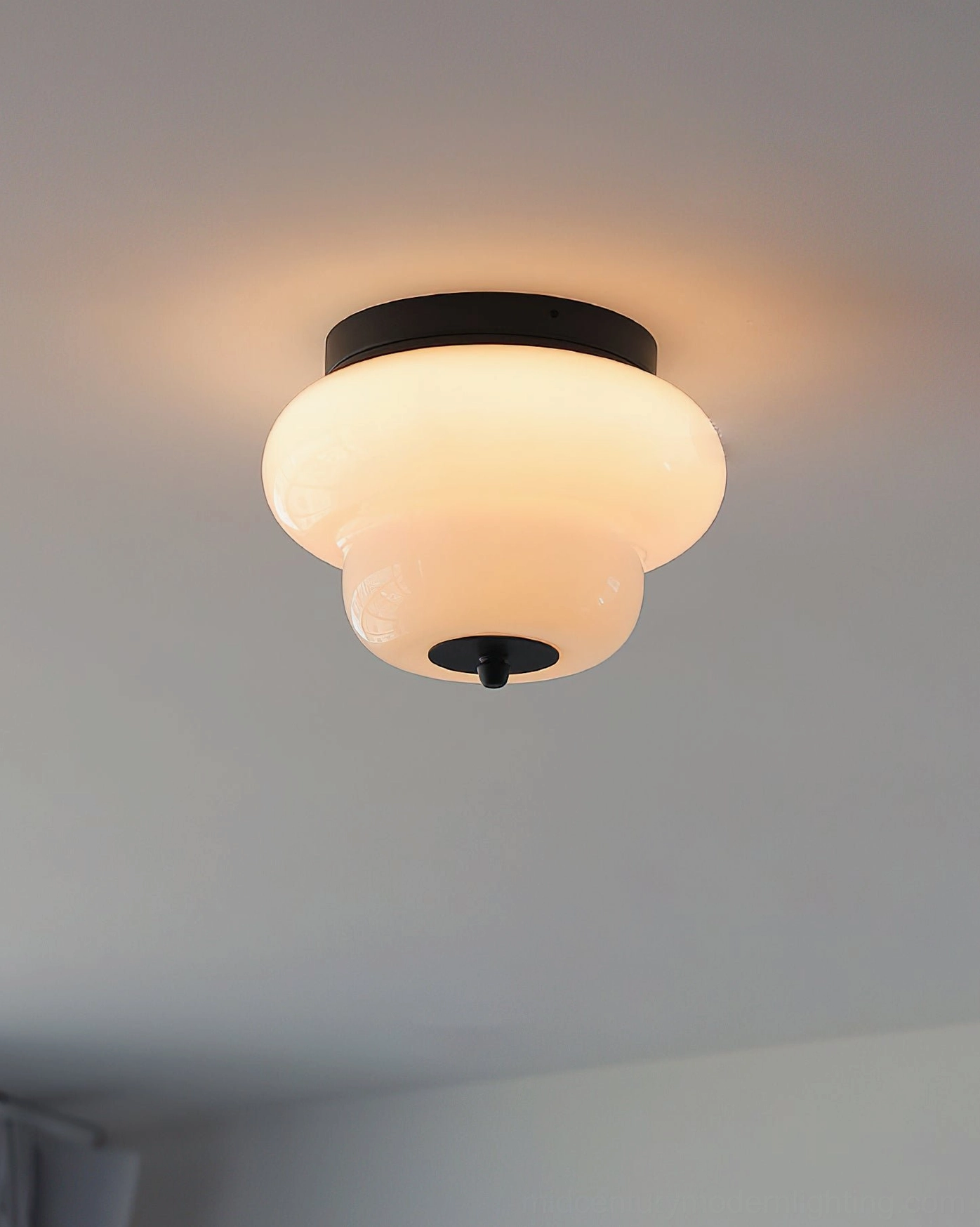 Milo two-tier hand-blown glass flush mount ceiling light architectural product photography on neutral background