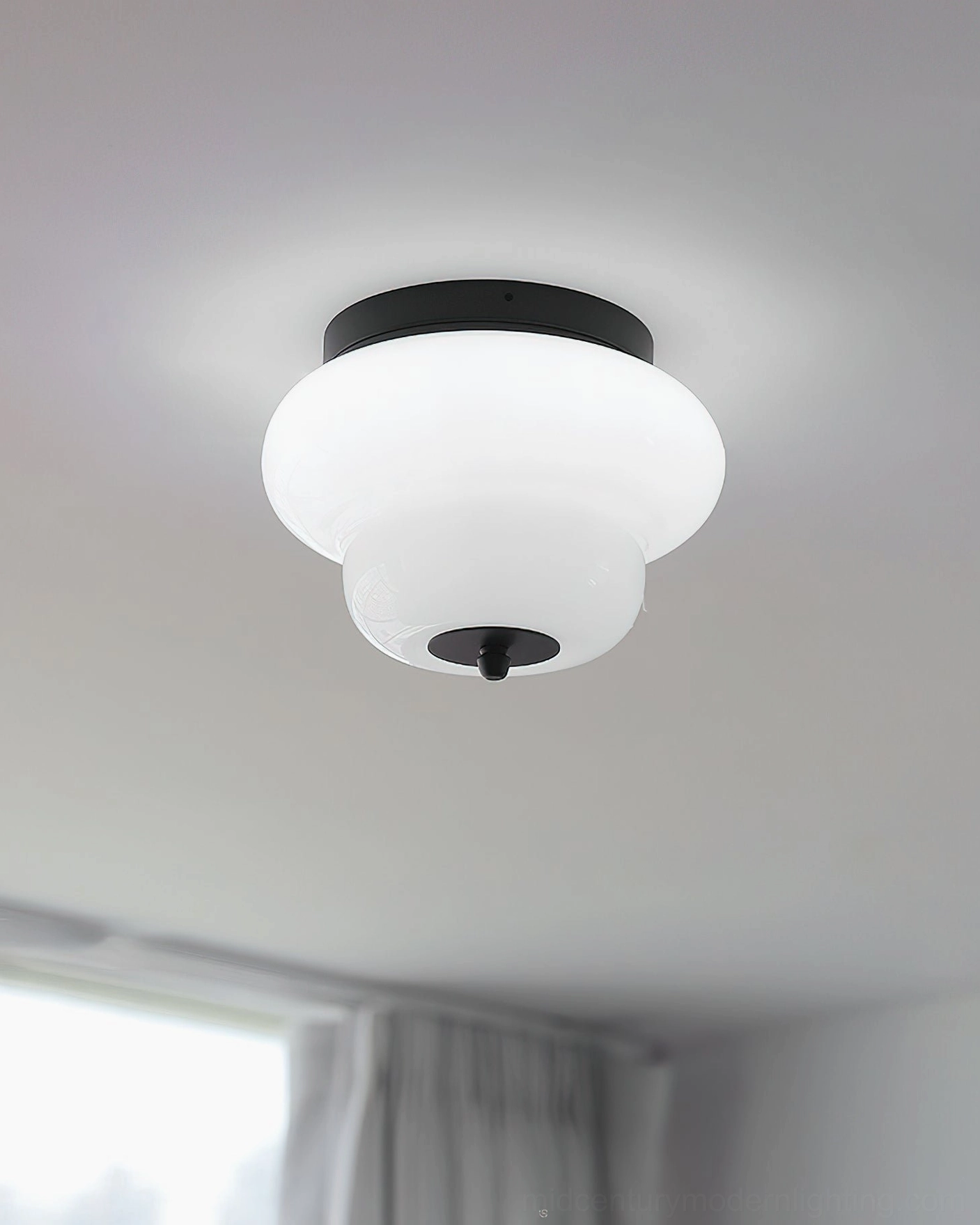 Milo flush mount ceiling light installed in walk-in closet overhead position showcasing compact footprint and space efficiency