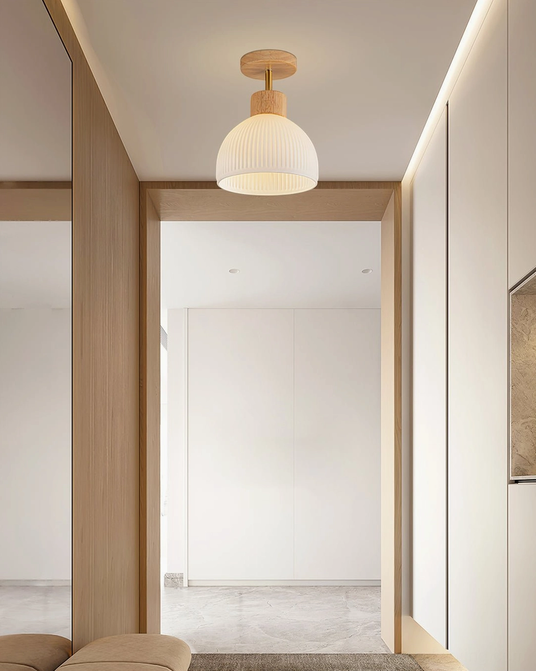 Modern ribbed ceiling light in bright airy entryway with built-in closets and clean lines