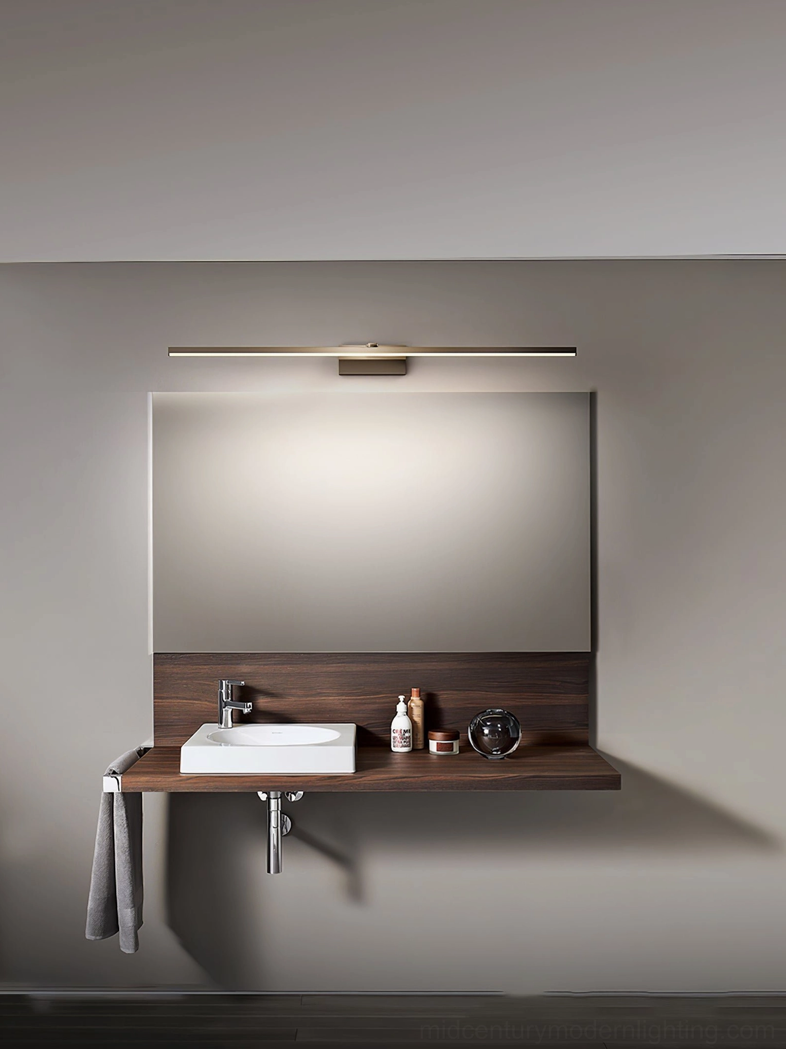 Minimalist bathroom interior with low-profile brass wall lamp
