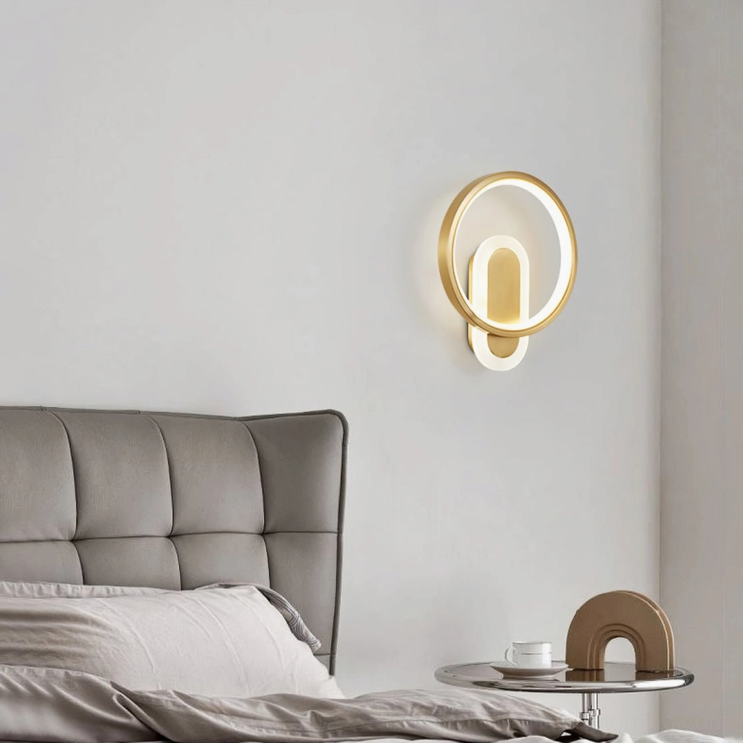 Modern LED wall light in bedroom with grey tufted headboard and decorative side table