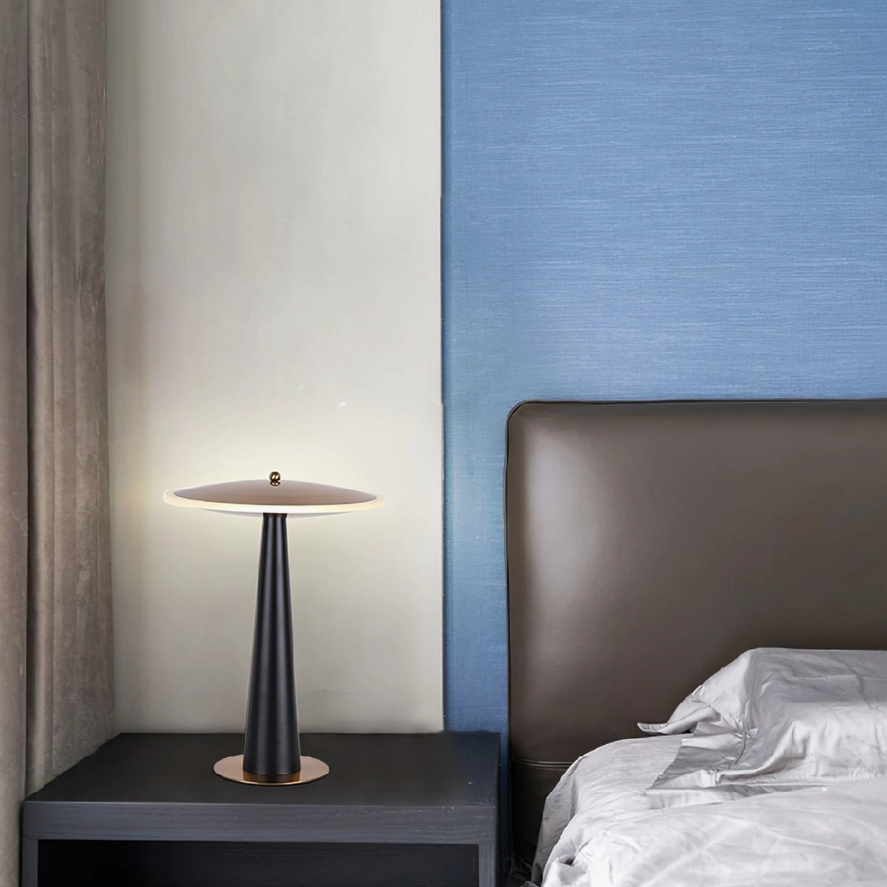 Modern black and gold drum lamp on bedroom side table with two-tone accent wall