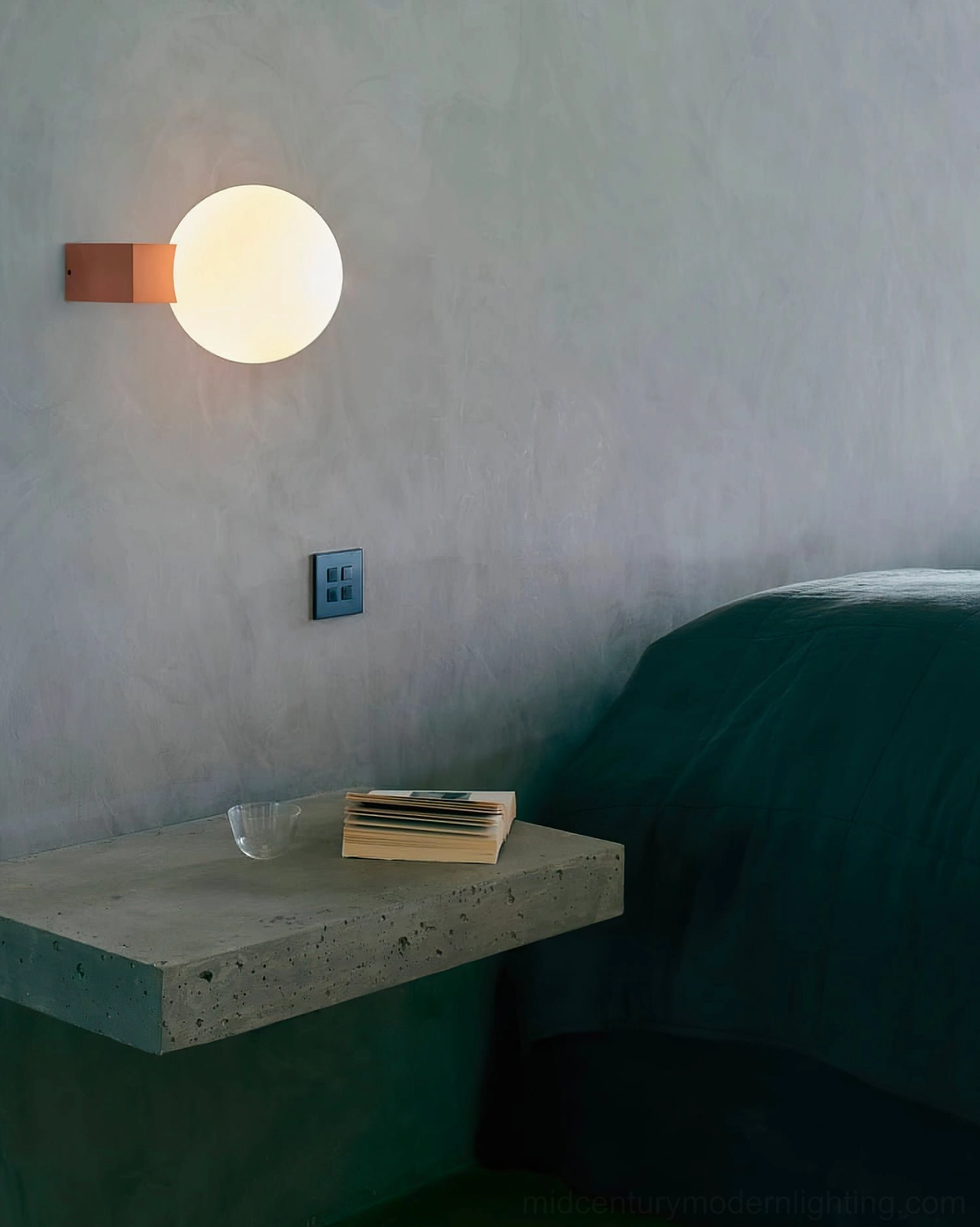 Modern minimalist globe wall lamp fixture displaying clean lines and contemporary aesthetic in neutral interior