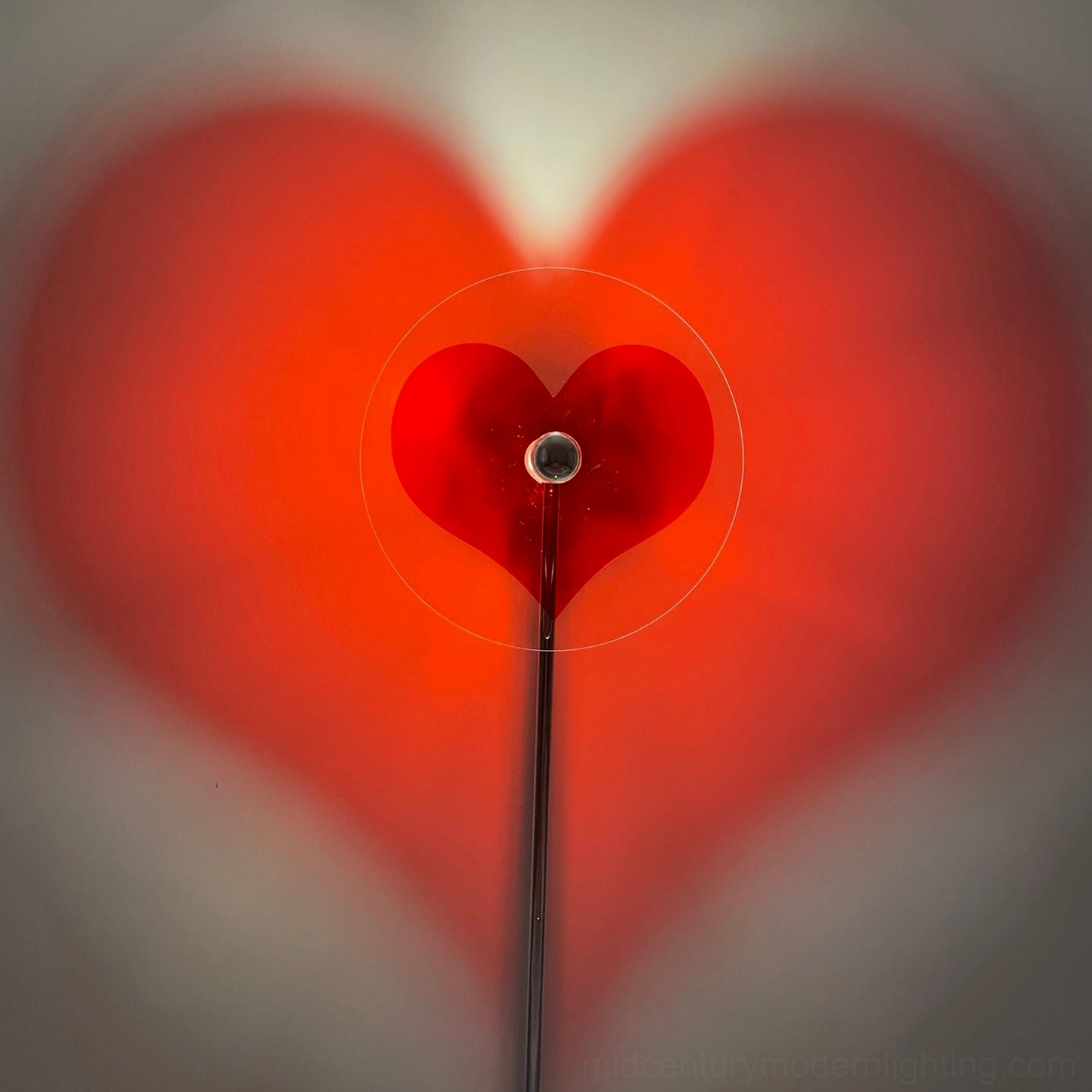 Modern heart projection floor lamp with chrome finish ideal for minimalist contemporary spaces