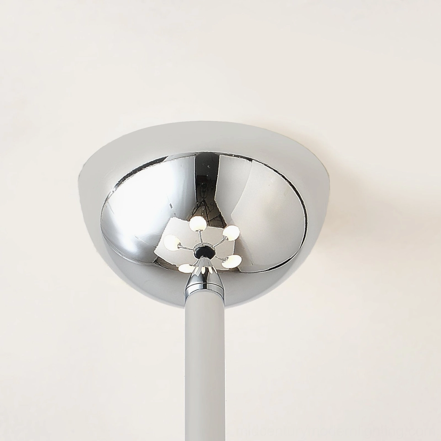 Multi-head globe chandelier fixture showcasing geometric minimalist design aesthetic